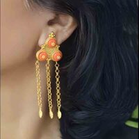Model wearing Traditional ethno Tibetan gilded brass designer norbu earrings