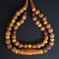 Double layered tibetan beaded necklace with jade amulet pendant